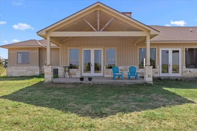 a view of a house with pool and porch