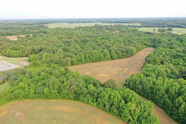 a view of a lake with a yard