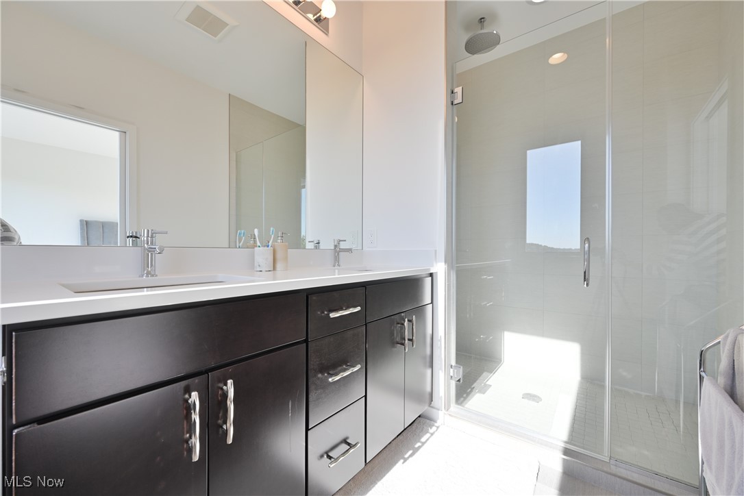 18875 Riversouth Terrace, Unit 35 Cleveland, OH 44126 - Photo 19 of 37 Full bath with double vanity and a shower stall