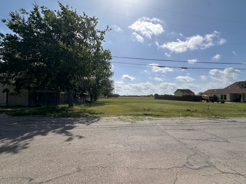 1200 Torres Street Lockhart, TX 78644 - Photo 2 of 3 a view of a yard with yellow lighting