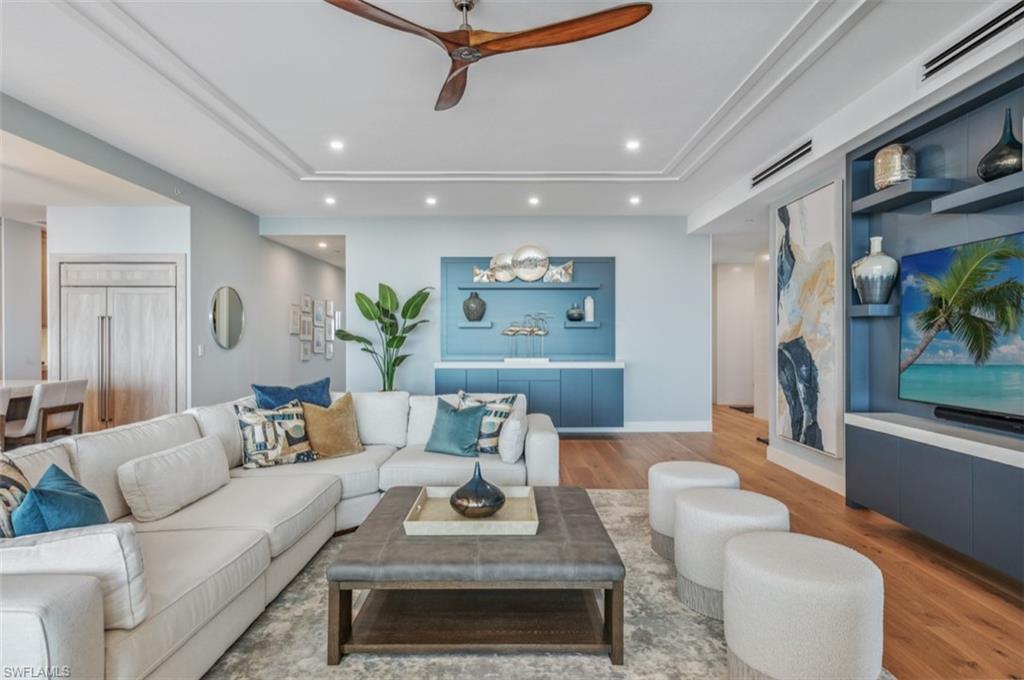 13925 Old Coast Road, Unit PH02 Naples, FL 34110 - Photo 13 of 33 a living room with furniture and a rug