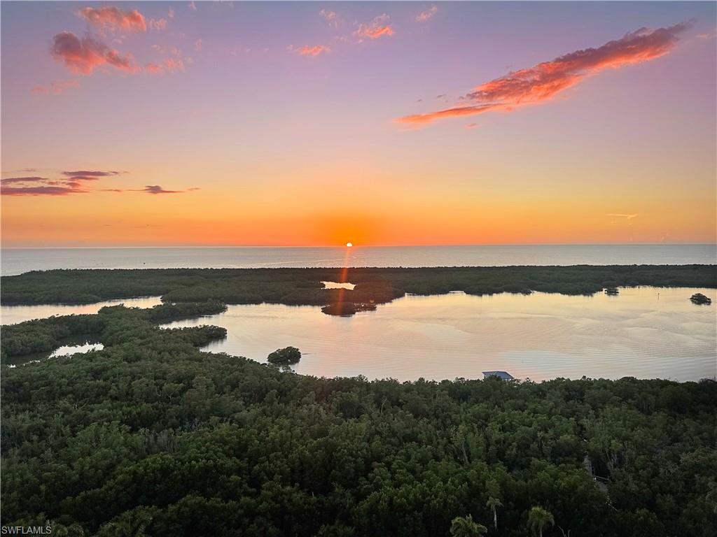 13925 Old Coast Road, Unit PH02 Naples, FL 34110 - Photo 9 of 33 a view of an ocean and beach