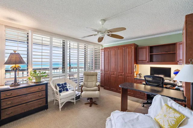 a work room with furniture and a window