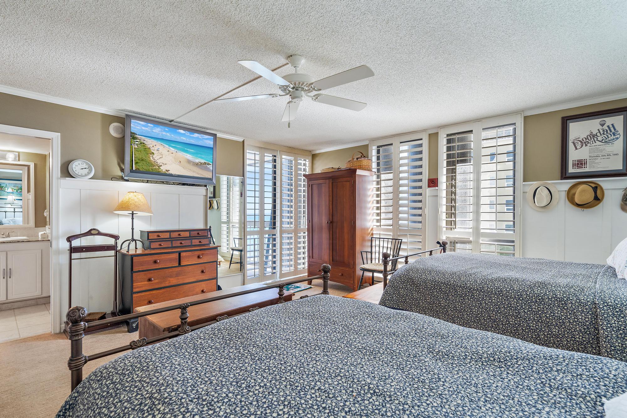 5380 North Ocean Drive, Unit 6D Singer Island, FL 33404 - Photo 15 of 41 a bedroom with a bed and wooden floor