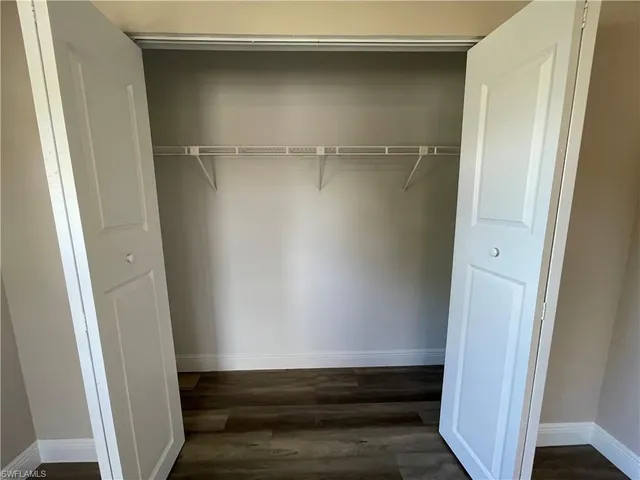 a bathroom with a toilet sink and shower