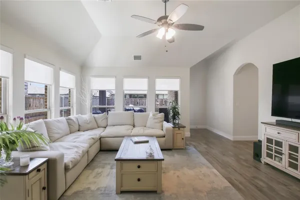 a living room with furniture and a flat screen tv