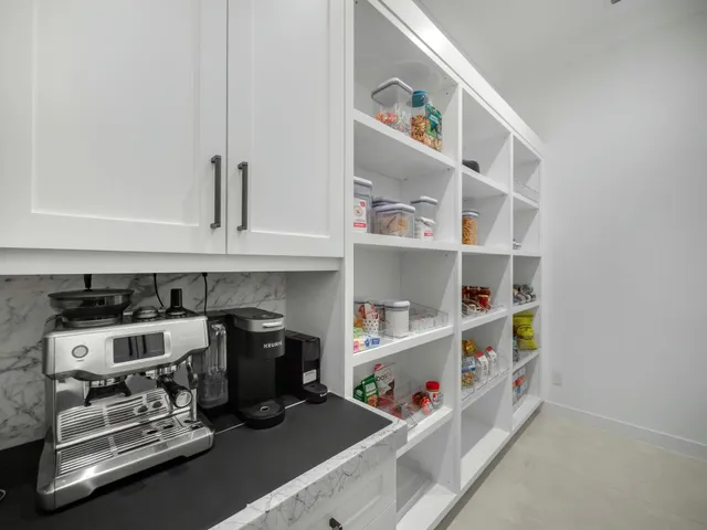 a view of swimming pool with seating area