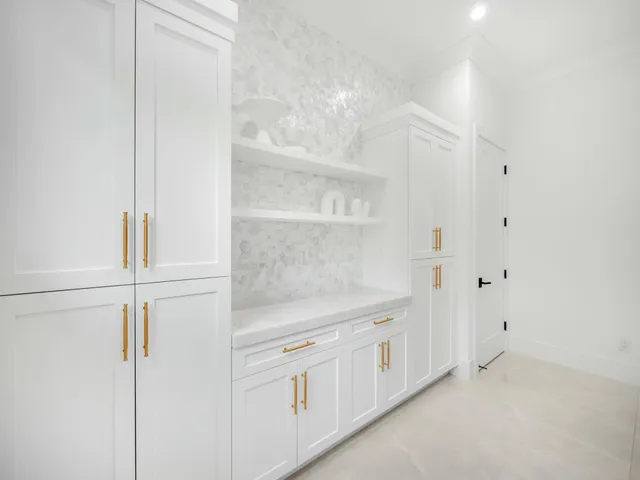 a spacious bedroom with a bed and a flat screen tv