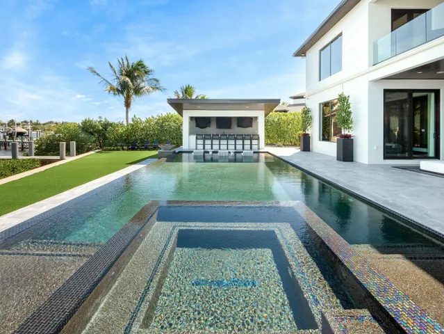 a spacious bathroom with a sink a mirror and a shower