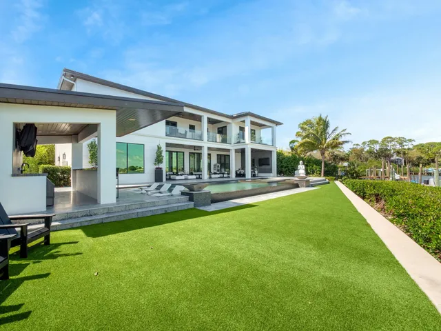 a kitchen with stainless steel appliances granite countertop a stove and a refrigerator