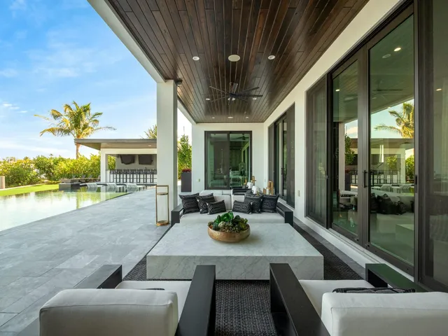 an aerial view of a house with a swimming pool