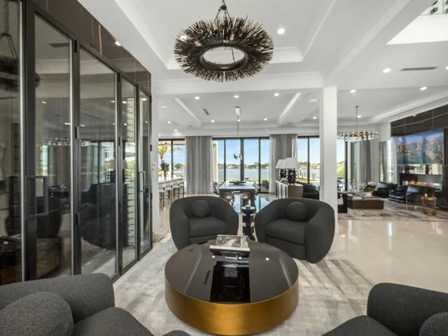 a large white kitchen with a large window