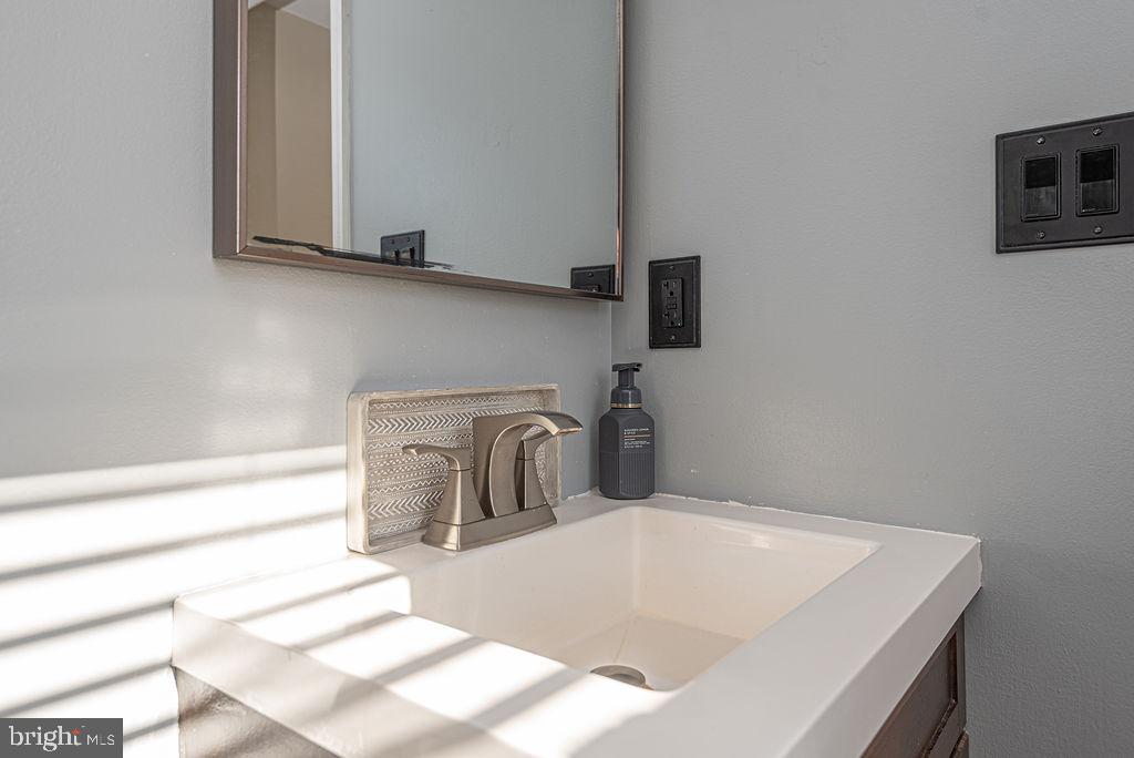 9530 Peerless Road Bishopville, MD 21813 - Photo 24 of 51 a bathroom with a sink and a mirror