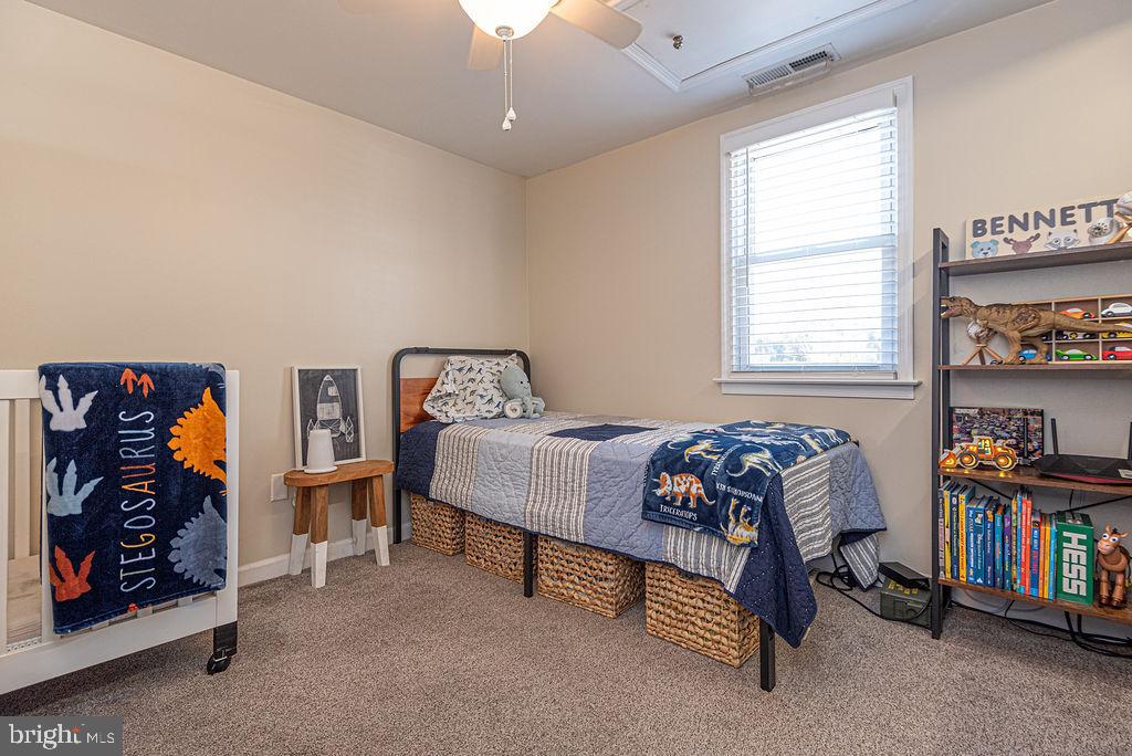 9530 Peerless Road Bishopville, MD 21813 - Photo 25 of 51 a bedroom with a bed and a book shelf