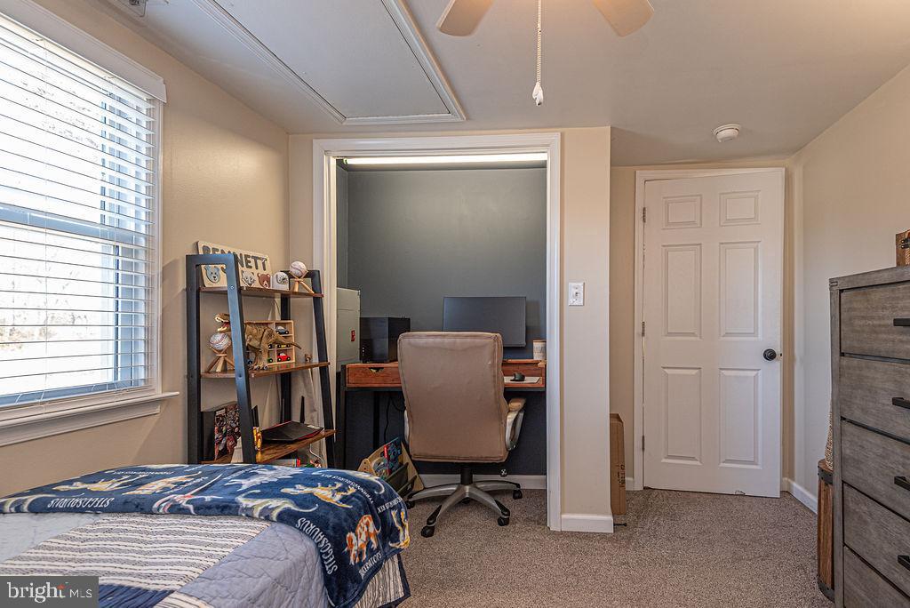 9530 Peerless Road Bishopville, MD 21813 - Photo 27 of 51 a bedroom with a bed and a chair