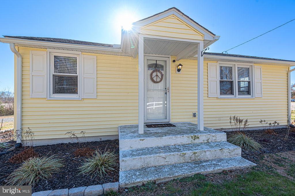 9530 Peerless Road Bishopville, MD 21813 - Photo 3 of 51 a front view of a house with garden