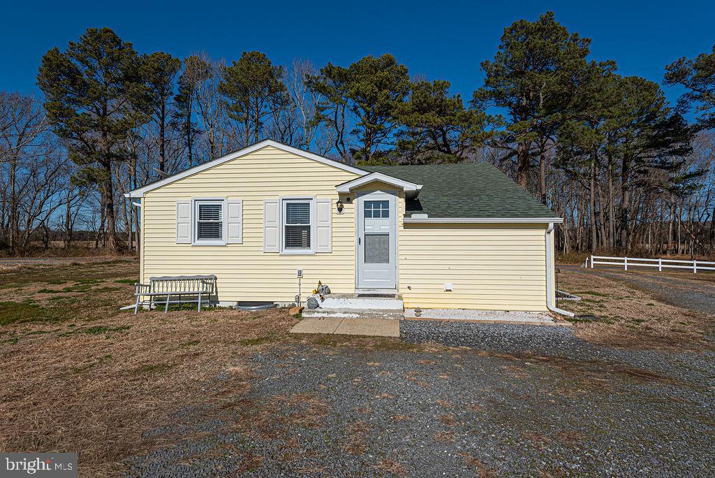 9530 Peerless Road Bishopville, MD 21813 - Photo 43 of 51 a view of a house with a yard and garage
