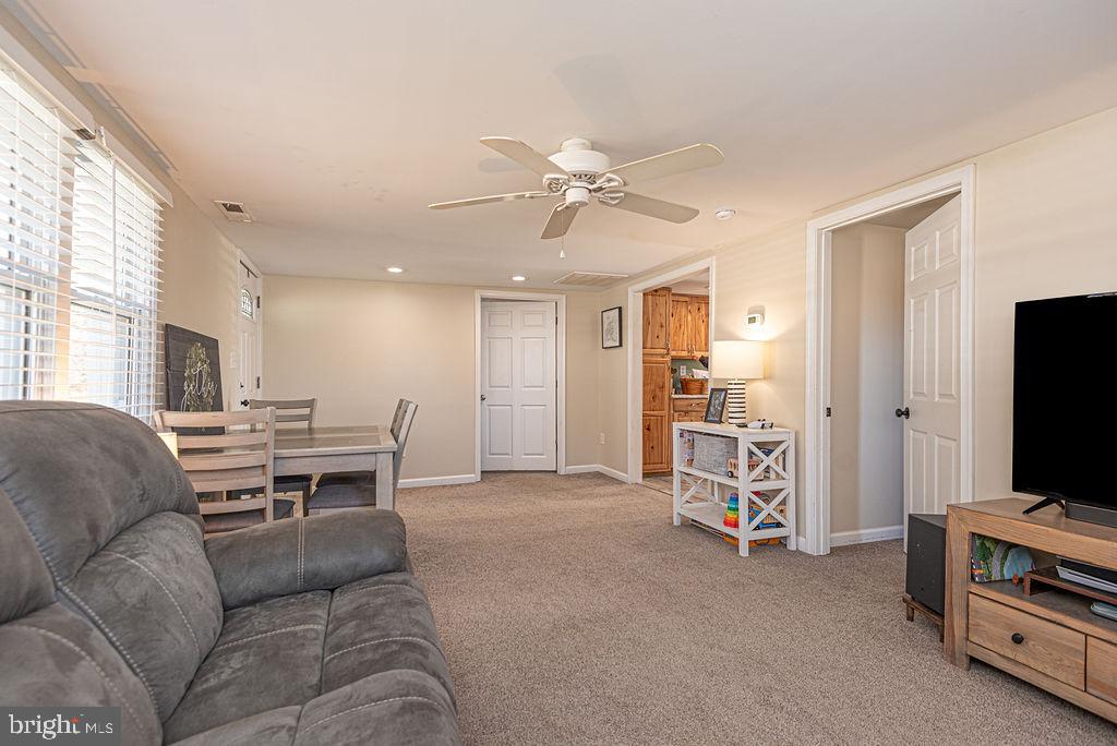 9530 Peerless Road Bishopville, MD 21813 - Photo 5 of 51 a living room with furniture and a flat screen tv