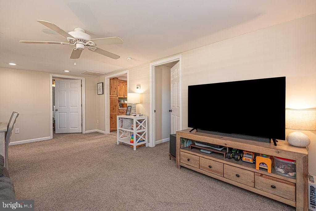 9530 Peerless Road Bishopville, MD 21813 - Photo 6 of 51 a room with furniture and flat screen tv