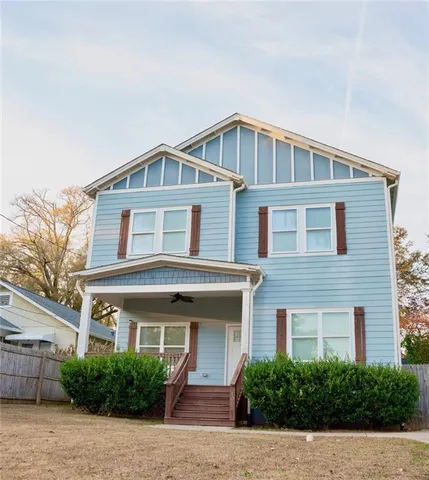 a view of a hallway with a ceiling fan