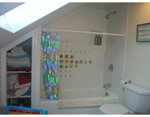 1037 Liberty Square Road Boxborough, MA 01719 - Photo 15 of 18 a bathroom with a bathtub and a shower
