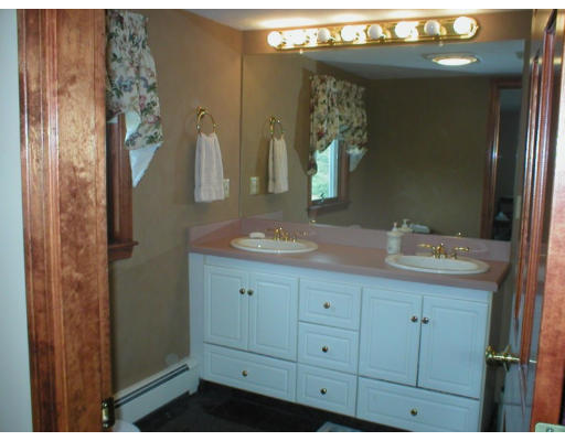 1037 Liberty Square Road Boxborough, MA 01719 - Photo 17 of 18 a bathroom with a sink and a mirror