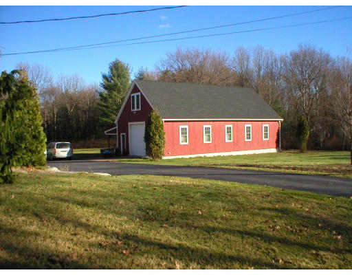 1037 Liberty Square Road Boxborough, MA 01719 - Photo 2 of 18 a view of a house with a yard