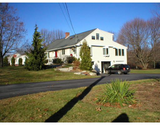 1037 Liberty Square Road Boxborough, MA 01719 - Photo 4 of 18 a front view of a house with a yard