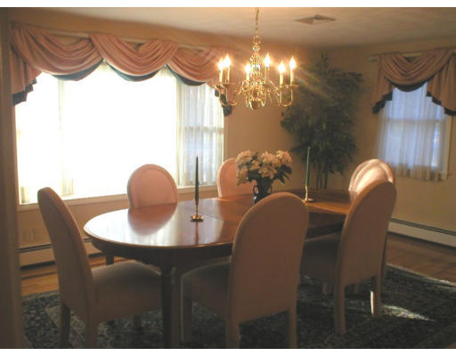 1037 Liberty Square Road Boxborough, MA 01719 - Photo 6 of 18 a dining room with furniture and chandelier kitchen view