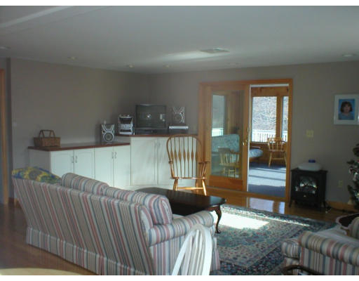 1037 Liberty Square Road Boxborough, MA 01719 - Photo 7 of 18 a bedroom with a bed and glass door