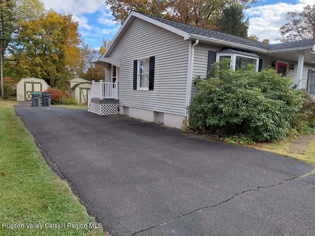 a view of a house with a street