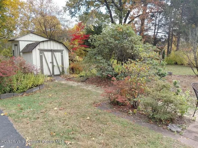 a backyard of a house with lots of green space