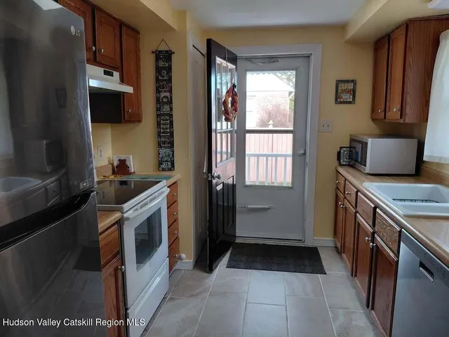 a kitchen with a stove and a refrigerator