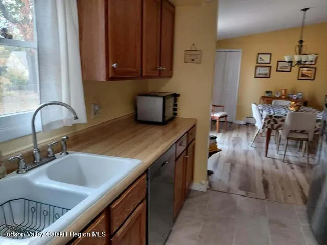 a kitchen with a sink and a stove top oven