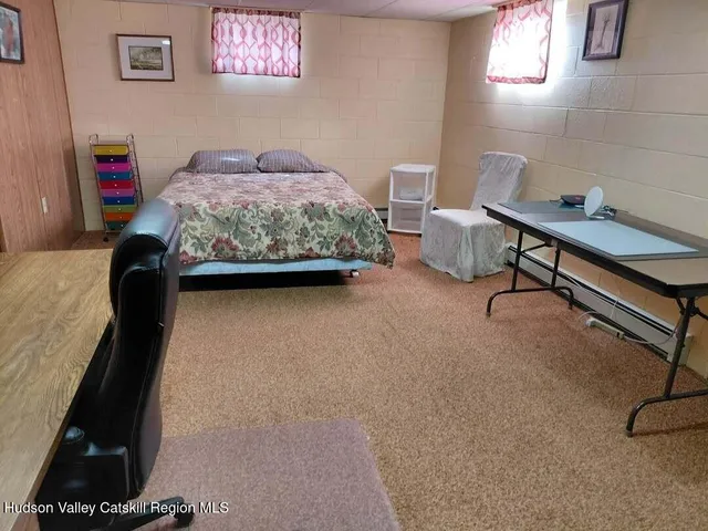 a bedroom with a bed and a table in it