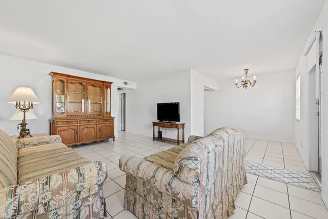 a bedroom with a bed and a television