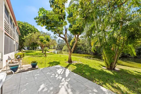 a view of yard with swimming pool