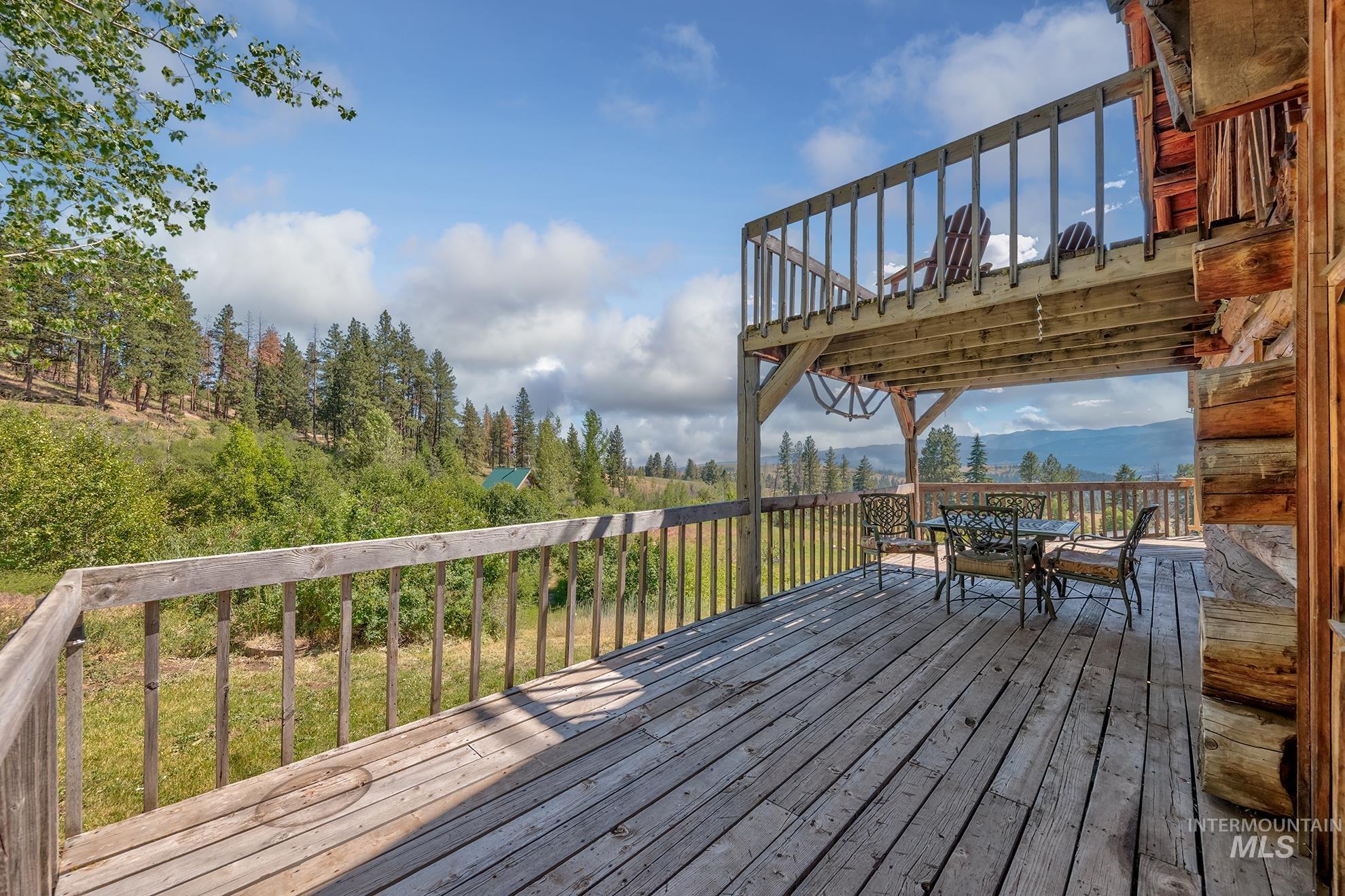 2150 Seid Creek Road Cambridge, ID 83610 - Photo 4 of 50 Expansive multi-level wood deck with natural wood railings, offering outdoor living space