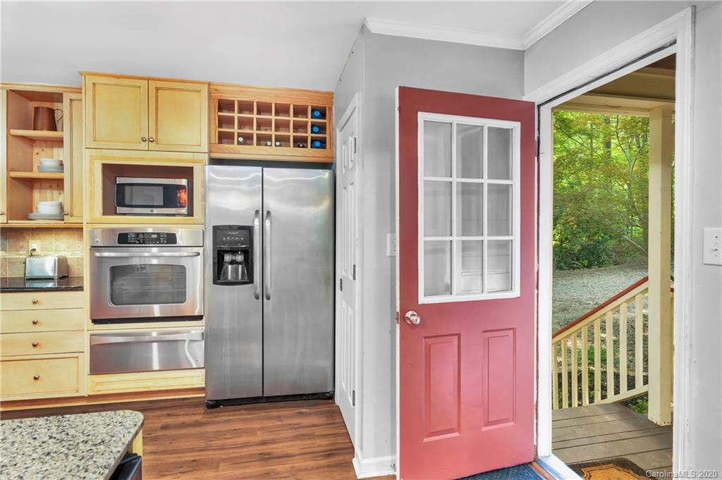 7109 New Town Road Waxhaw, NC 28173 - Photo 17 of 31 a view of kitchen with wooden floor and electronic appliances