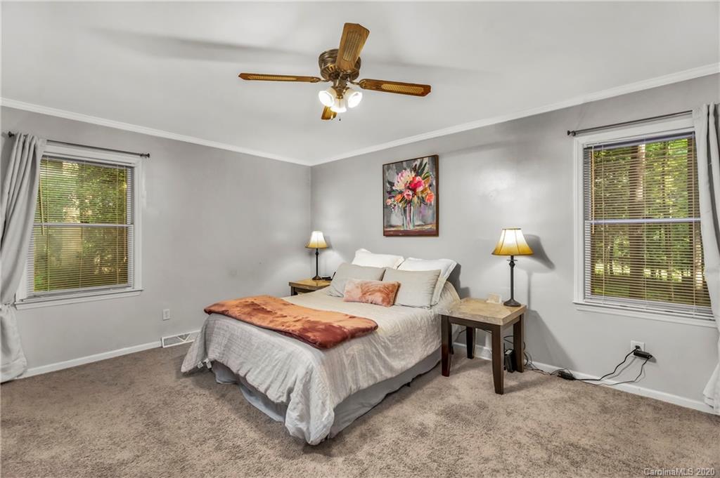 7109 New Town Road Waxhaw, NC 28173 - Photo 18 of 31 a bedroom with a bed and a window