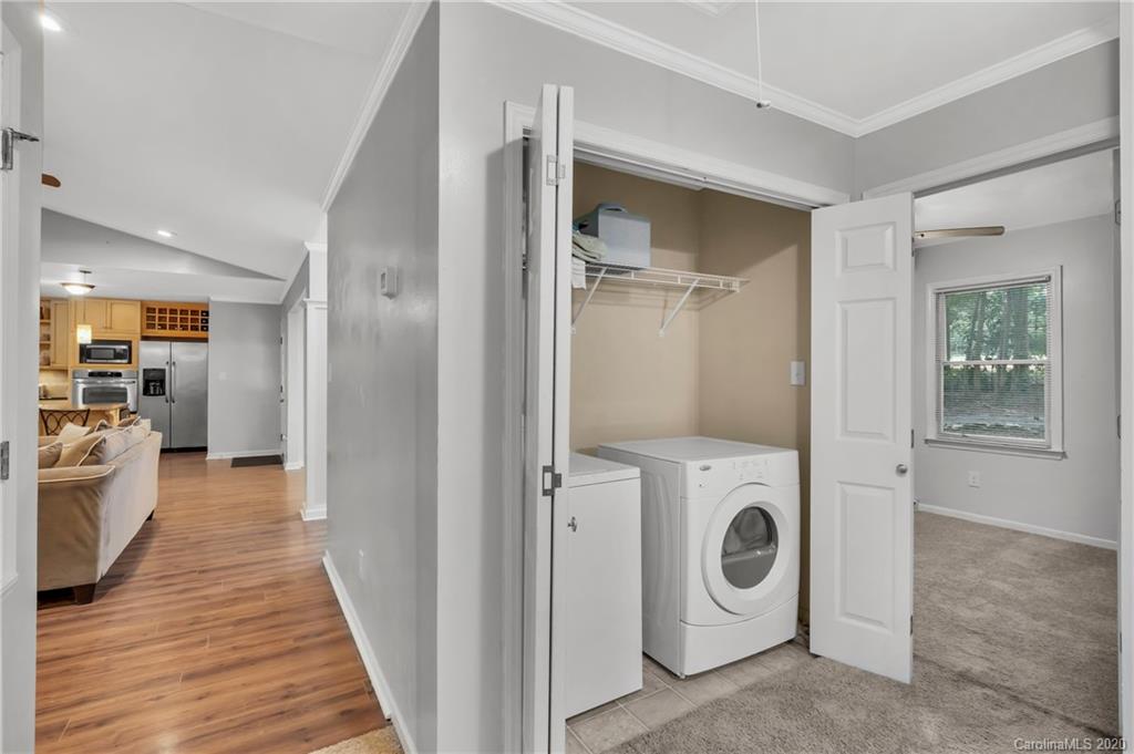 7109 New Town Road Waxhaw, NC 28173 - Photo 24 of 31 a view of a hallway with washer and dryer