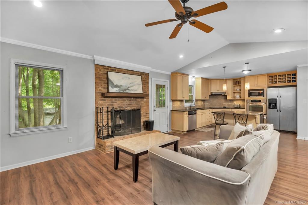 7109 New Town Road Waxhaw, NC 28173 - Photo 8 of 31 a living room with furniture kitchen view and a window