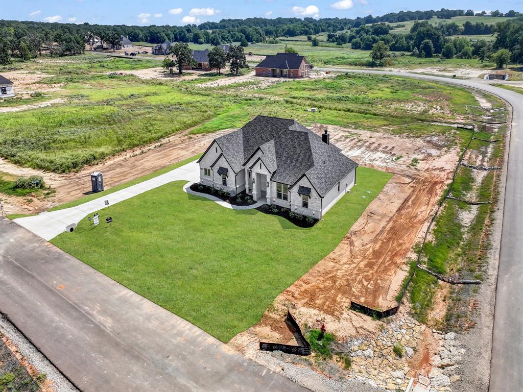 2000 Forest Bridge Drive Azle, TX 76020 - Photo 11 of 34 a view of a garden with an outdoor space and seating area