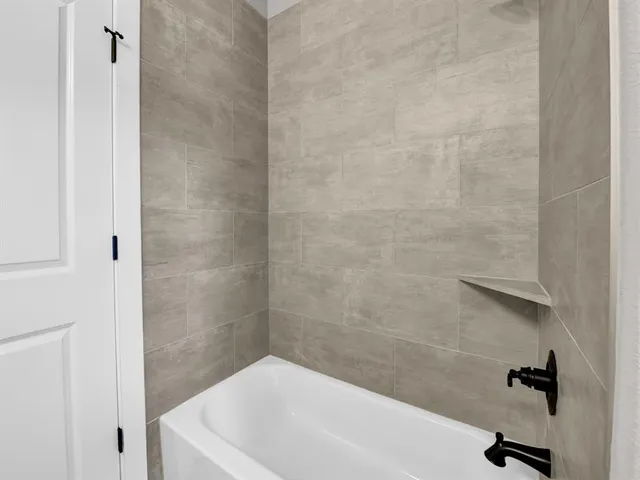 a bathroom with a white bath tub