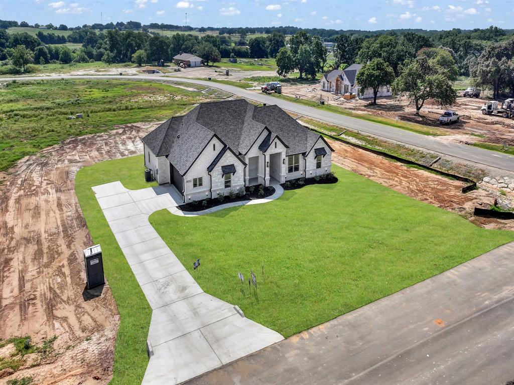 2000 Forest Bridge Drive Azle, TX 76020 - Photo 9 of 34 a view of a swimming pool with a yard