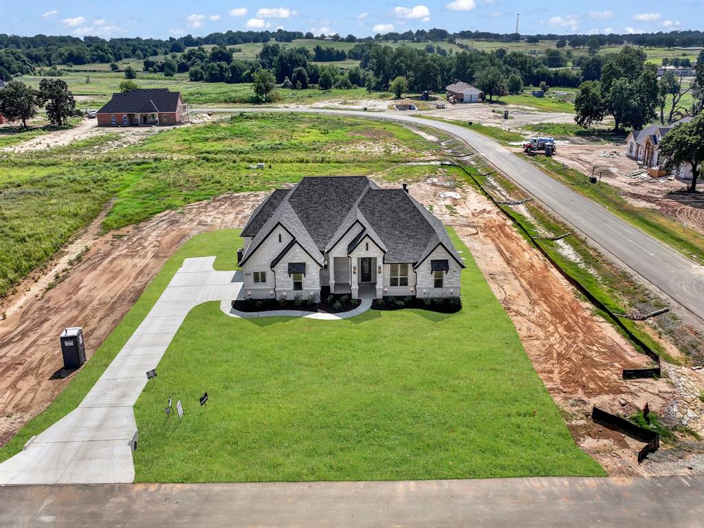 2000 Forest Bridge Drive Azle, TX 76020 - Photo 10 of 34 a view of a house with a yard