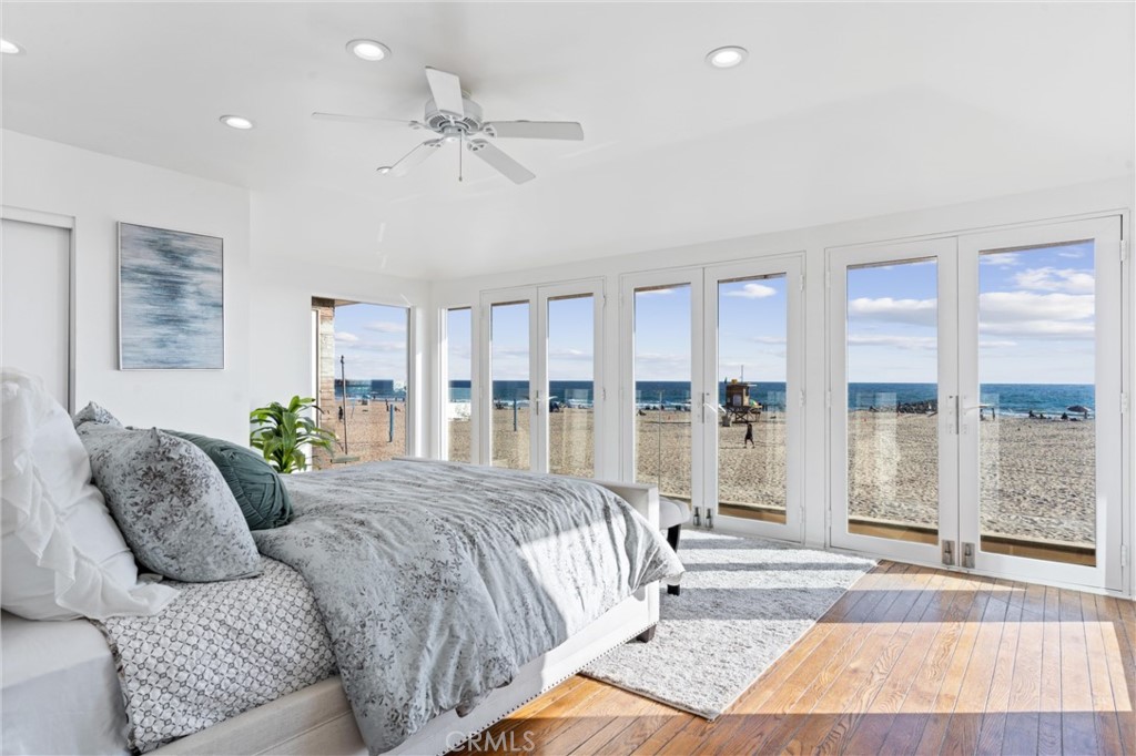 2804 West Oceanfront Newport Beach, CA 92663 - Photo 15 of 41 a living room with a bed furniture and a large window