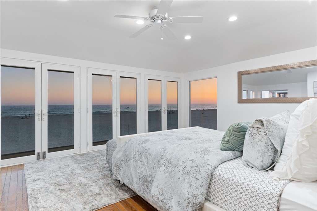 2804 West Oceanfront Newport Beach, CA 92663 - Photo 16 of 41 a large bedroom with a large bed and a large window
