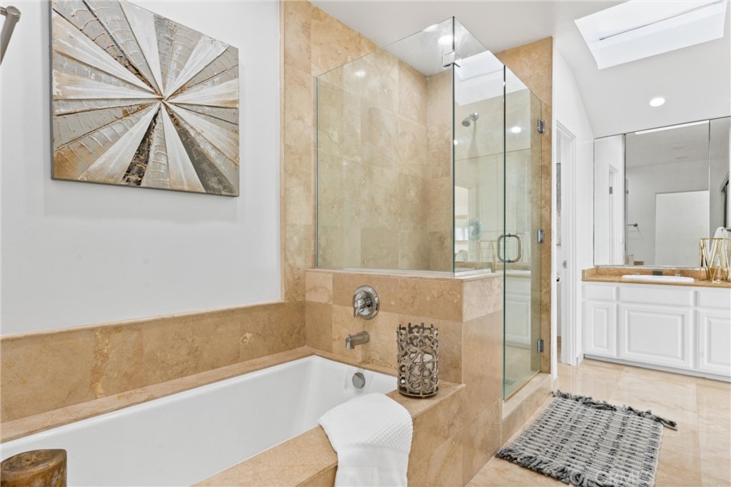 2804 West Oceanfront Newport Beach, CA 92663 - Photo 18 of 41 a bathroom with a bathtub and a shower