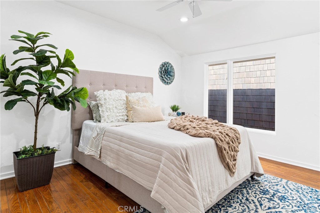 2804 West Oceanfront Newport Beach, CA 92663 - Photo 19 of 41 a bedroom with a bed and a potted plant